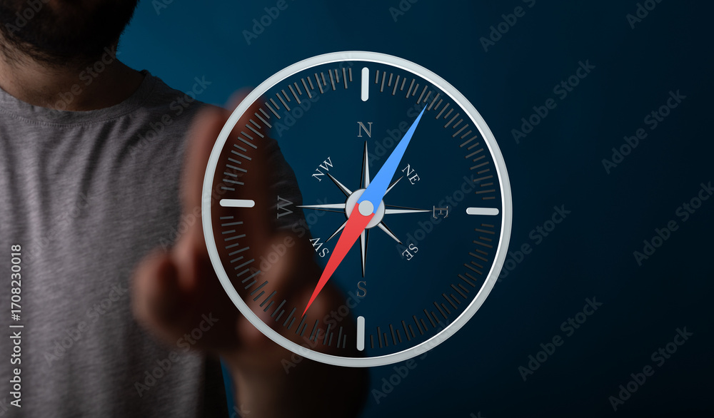 Poster Conceptual image of a man using a digital compass app on a touchscreen device.  Find your way.