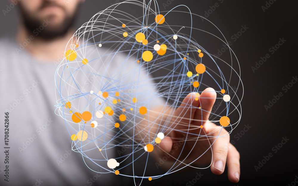 Poster abstract image of a man's hand interacting with a digital network sphere, representing connection an