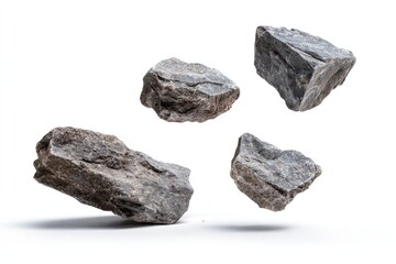 Four grey stones levitating against a white background