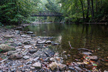Footbridge Crossing Rustic River in North Carolina