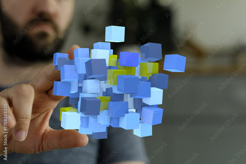 Poster abstract image of a man interacting with a 3d data visualization of blue and yellow cubes. perfect f