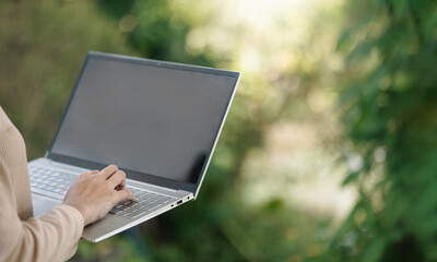 Remote work with laptop outdoors concept of digital nomad and online connection