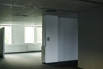 Stock photo of a vacant office space with large windows, ideal for showcasing renovation or real estate concepts.