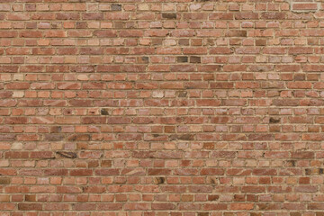 High-resolution image of a red brick wall, perfect for backgrounds and textures.  Ideal for design projects.