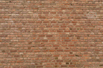 High-resolution image of a red brick wall, perfect for backgrounds and textures.  Ideal for design projects.