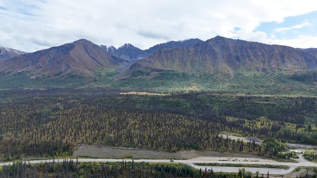 Cinematic Parallel Drone Car Follow over Parks Highway in Alaska near Denali National Park