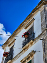 Bridge builders. Asian construction workers are on the roof structure of the building in the construction area. Insulation of the walls of the house. Construction site workers concept.