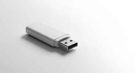 A simple, white flash drive rests on a plain white surface, showcasing a sleek design and minimalist aesthetic.