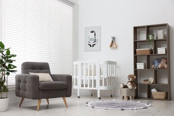 Baby's room with crib and armchair. Interior design
