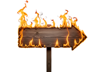 A wooden directional sign ablaze with vibrant flames against a stark black background.