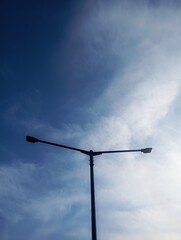 Obraz premium lamp post against blue sky