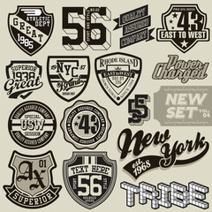 Assorted vintage-style emblem designs with shields, numbers, and text, predominantly in black, white, and gray, arranged on a neutral beige background, creating a nostalgic, graphic mood.