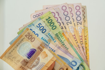 various denominations Albanian lek currency featuring national landmarks, Financial transactions or travel preparation involving local currency in Balkans, inflation, national currency money