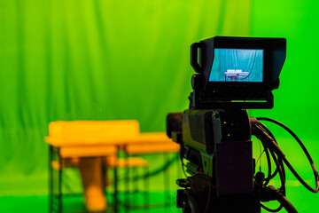 The television station's live broadcast room has a video camera filming the program.