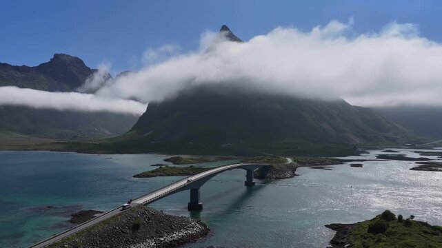Cars crossing fredvang bridges in lofoten islands, norway