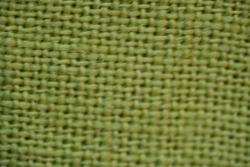 light green bfabric canvas burlap  pistachio burlap fabric texture – close-up background top view 