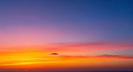 Breathtaking Sunset Over Calm Ocean with Vibrant Colors and Cloudy Sky at Dusk