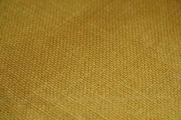 Yellow bfabric canvas burlap  urlap fabric texture – close-up background top view 