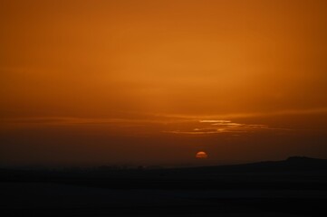 Serene sunset over a vast landscape.