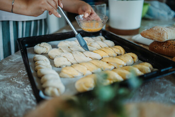 Young caucasian woman making bread dough with rolling pin and flour	

