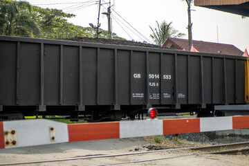 Photo of a train carriage transporting coal. Coal train carriage.