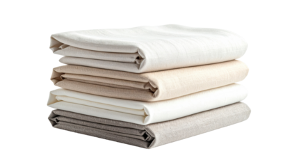 Stack of folded linen sheets in varying shades of beige and cream