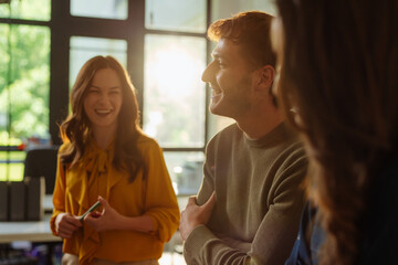 Business team laughing during a meeting in the office