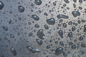 Water droplet pattern and texture background on black plastic. For graphic design and banners