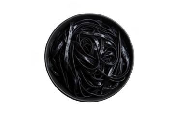 Delicious black squid ink linguine pasta in bowl food photography stock image, gourmet meal, isolated on transparent background