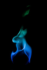 Ethereal Blue and Green Flames Dancing Against a Black Background