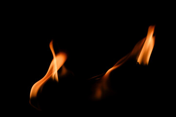 Flames Flickering Wildly Against a Dark Background in Low Light
