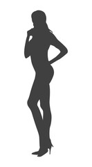 Silhouette of a Contemplative Figure: A poised silhouette of a slender individual exudes quiet thoughtfulness, standing gracefully in a studio setting.