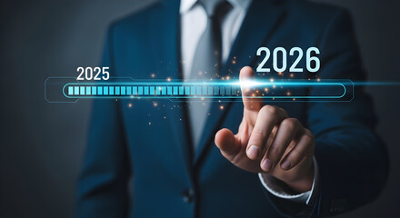 Businessman in a dark suit interacts with a futuristic digital timeline showing the transition from 2025 to 2026 representing future technology and innovation concepts
