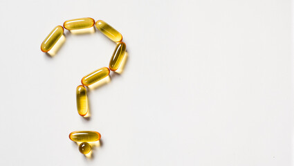 Curious arrangement of yellow capsules forming a question mark shape