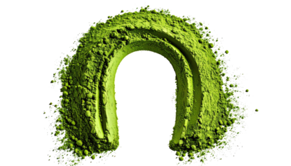 A vibrant green horseshoe shape formed from powder