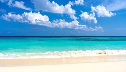 Obraz premium A serene beach scene featuring crystal-clear turquoise water, a gentle tide, and fluffy white clouds against a bright blue sky
