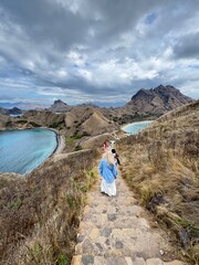 Adventurous hikers explore the scenic trails, enjoying views of Padar Island, its stunning...
