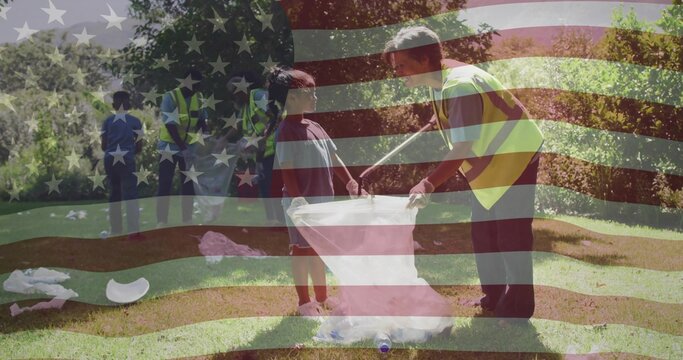 Collecting volunteers in safety vests picking up debris on park lawn, with plastic bottles