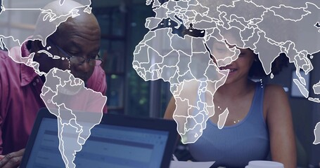 Reviewing documents, red shirt man wearing glasses and blue top woman at office table, with laptop