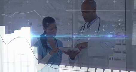 Reviewing medical data on tablet by doctor and nurse in hospital consultation with digital graphs