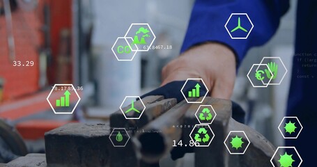 Clamping machinist gloved hand securing metal pipes in workshop vise with hex icons and metrics