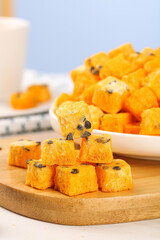 Freeze-dried passion fruit blocks healthy instant snack cubes with tea drinking setup