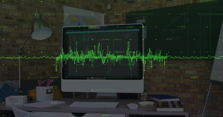 Displaying monitor showing green waveform at desk against brick wall, with lamp, keyboard and mouse