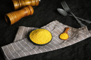 Raw Yellow Millet Grains in Bowl - Nutritious Whole Grain Cereal from Shanxi China for Healthy Breakfast