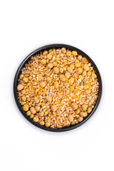 Eight grain cereal combination with soybeans and mixed seeds in black bowl for healthy porridge and cooking ingredients