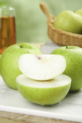 Fresh Green Pears Sliced and Whole on White Plate - Healthy Organic Fruit