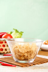 Dried Tofu Skin Soybean Product in Glass Bowl with Vegetables and Chopsticks Asian Vegetarian Cooking Ingredient