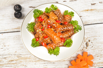 Grilled Fish Fillets with Spicy Red Peppers and Fresh Herbs on Rustic White Plate
