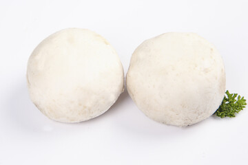 Fresh White Mushrooms with Herbs on White Background - Delicious Cooking Ingredients Shot