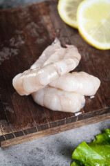 Fresh Raw Jumbo Shrimp on Wooden Board with Lemon - Premium Qingdao Seafood Ingredient